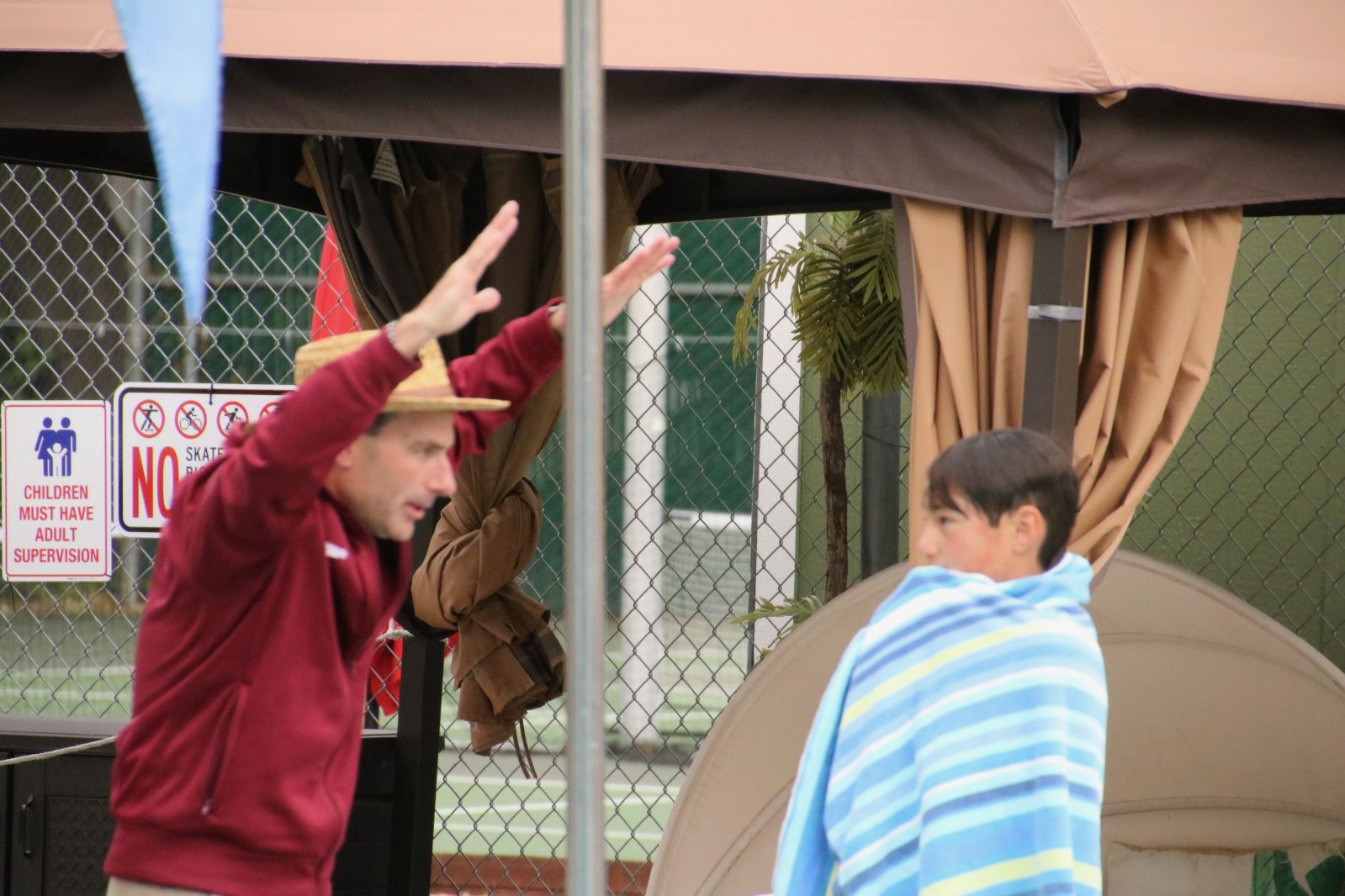 Coach Ryan helping kids at swim clinic