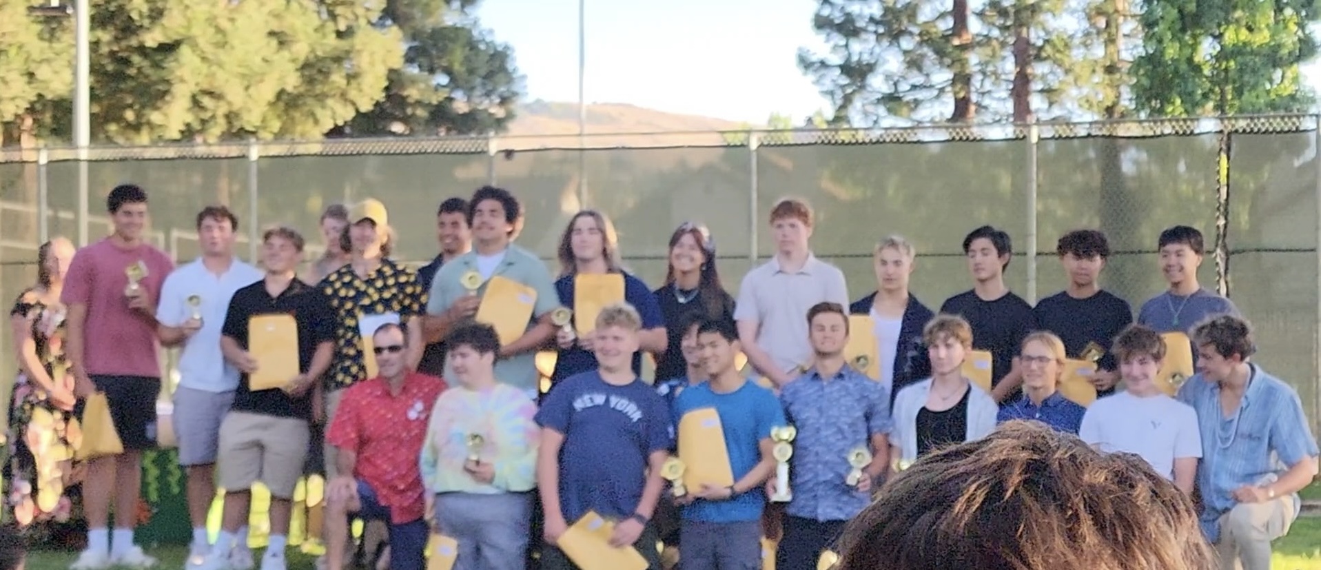Boys with trophies at banquet