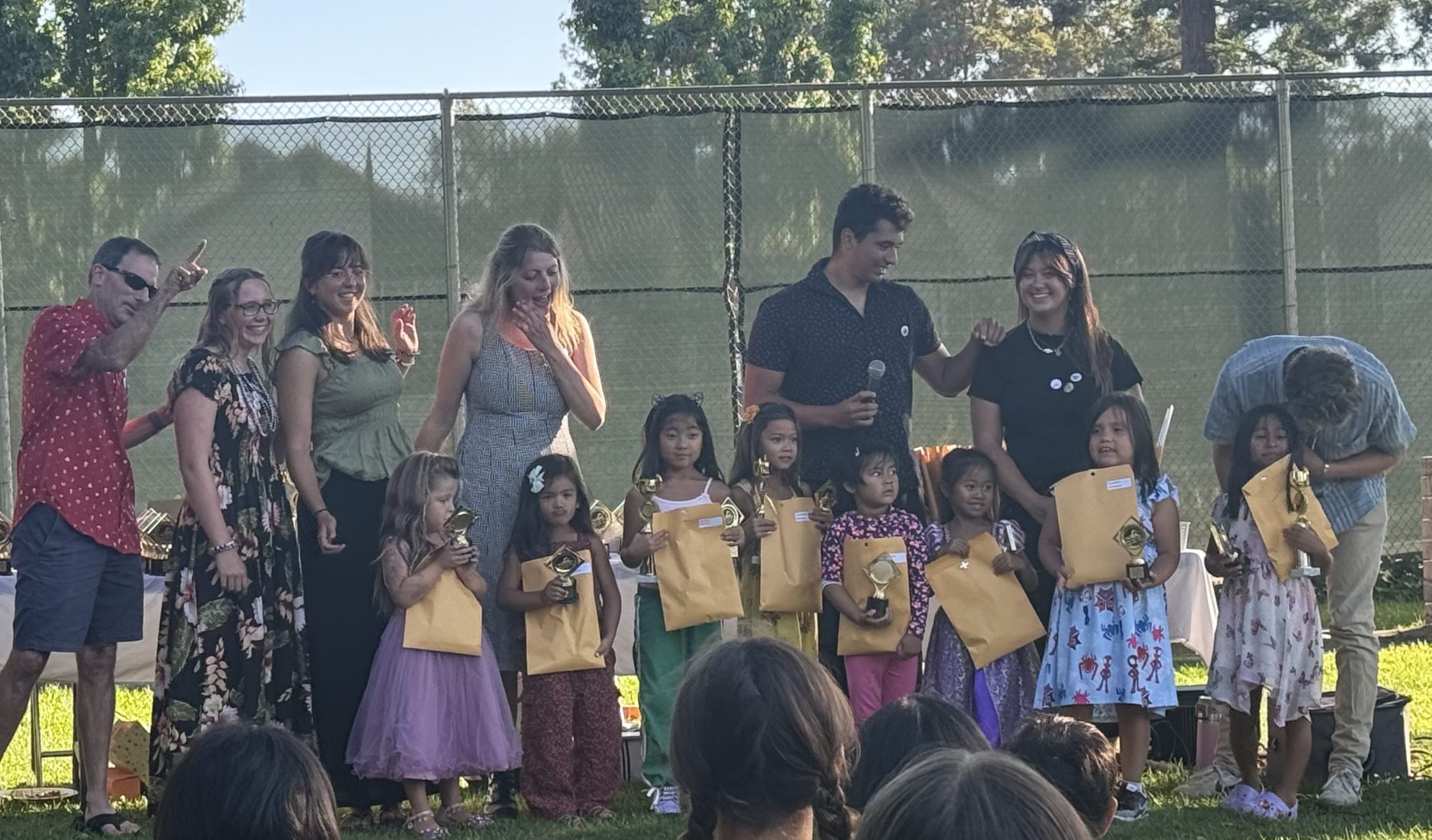 Girls with trophies at banquet