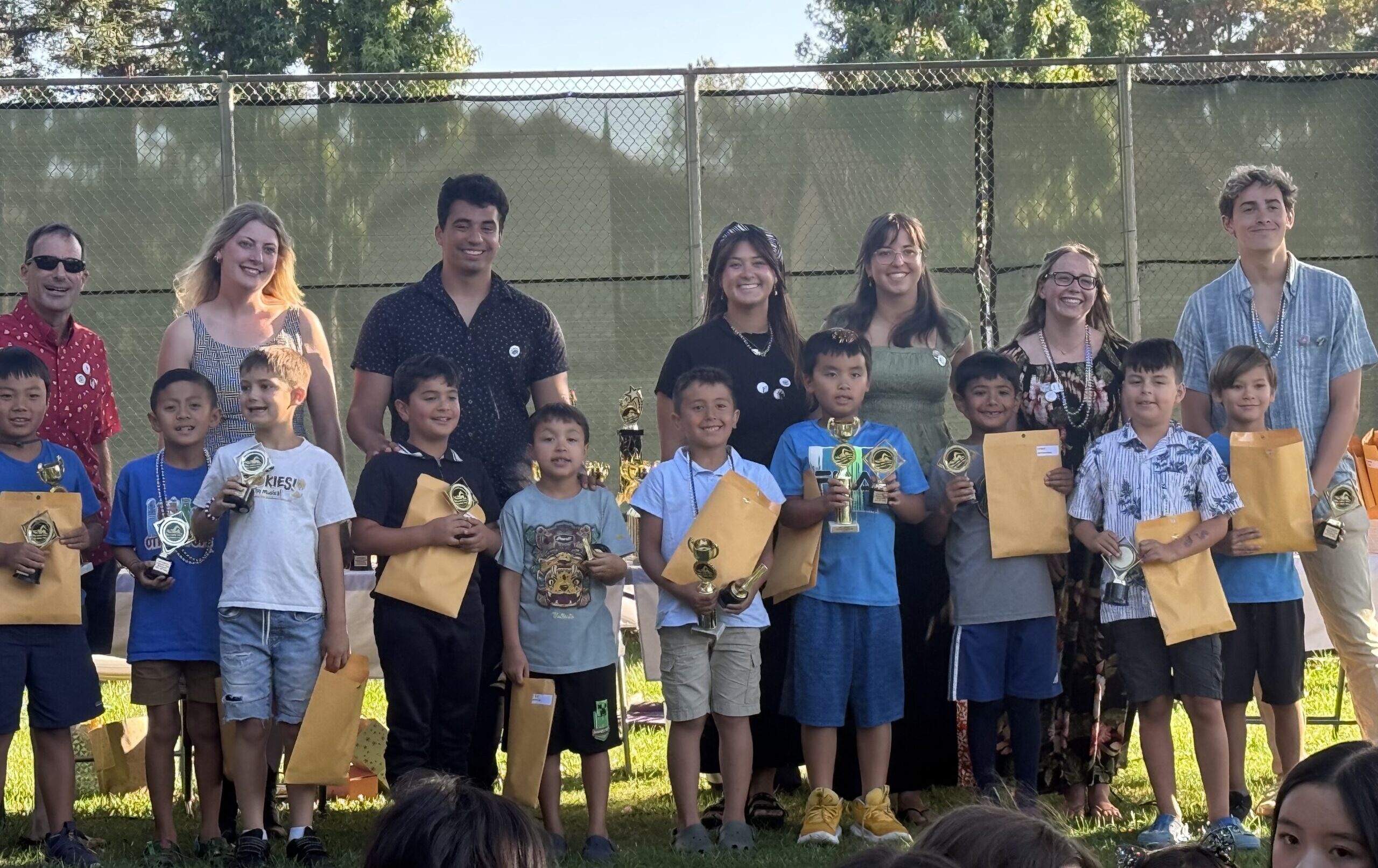 Boys with trophies at banquet